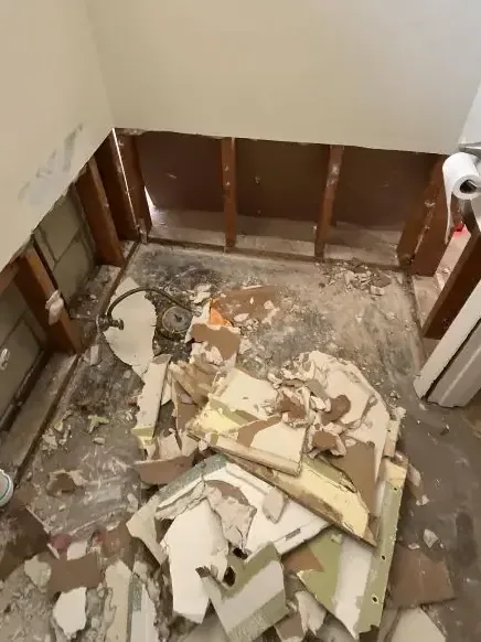 A bathroom stripped to the studs after a sewage backup